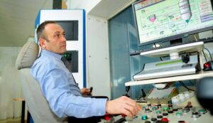 stockphotoscom-7544683 man typing at factory computer-small