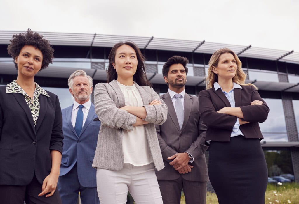 Confident diverse business team standing outdoors