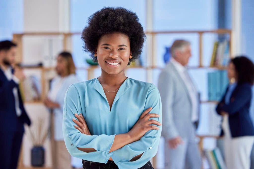 Confident young woman smiling in business office setting