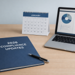 A modern office desk with a blue folder labeled &ldquo;2026 Compliance Updates,&rdquo; a January 2026 desk calendar, and a laptop displaying charts and legal documents in a clean blue and gray workspace.