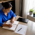 Worker documenting workplace injury claim at desk