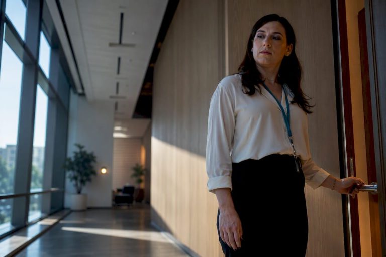 Employee paused outside workplace restroom
